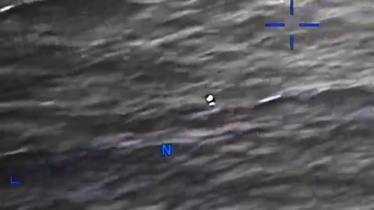 DOW-UAP-PR056, "Spherical UAP pulsing over water [CALLSIGN]"