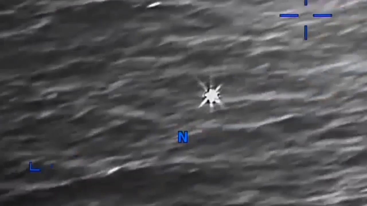 DOW-UAP-PR056, "Spherical UAP pulsing over water [CALLSIGN]"