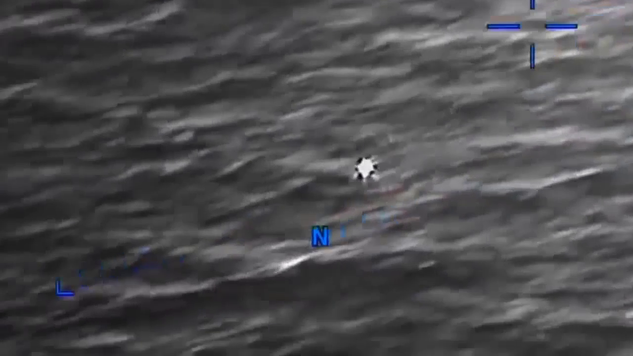 DOW-UAP-PR056, "Spherical UAP pulsing over water [CALLSIGN]"