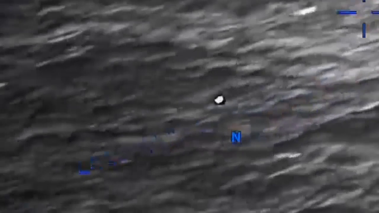 DOW-UAP-PR056, "Spherical UAP pulsing over water [CALLSIGN]"