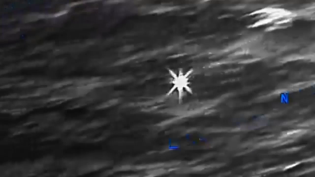 DOW-UAP-PR056, "Spherical UAP pulsing over water [CALLSIGN]"