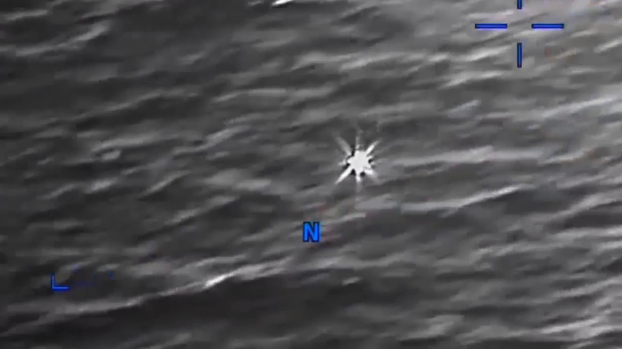 DOW-UAP-PR056, "Spherical UAP pulsing over water [CALLSIGN]"