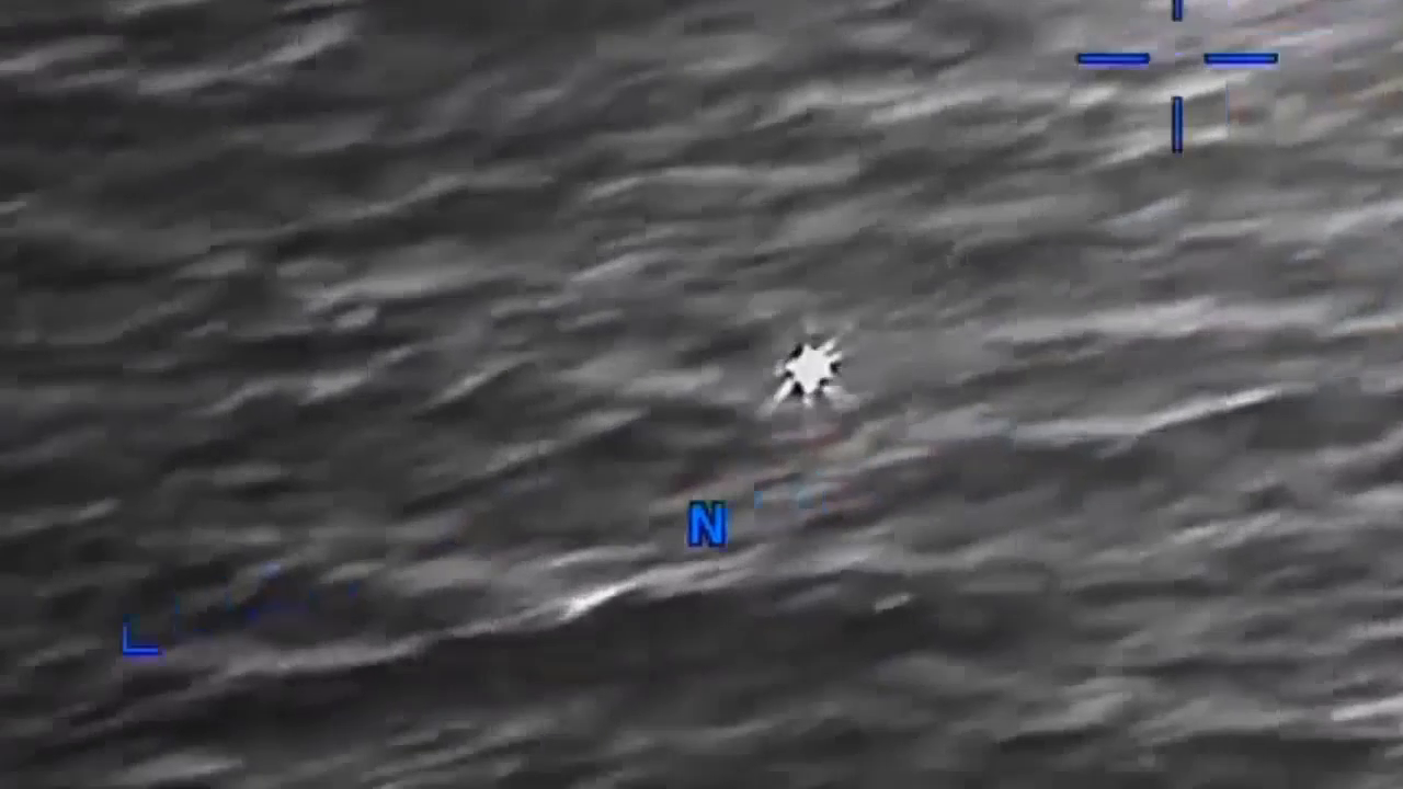 DOW-UAP-PR056, "Spherical UAP pulsing over water [CALLSIGN]"